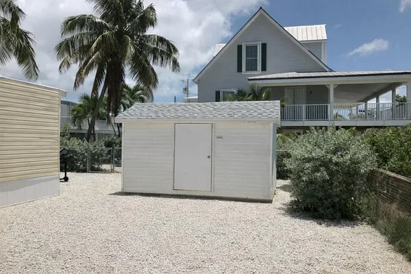 a view of a house with a yard and garage
