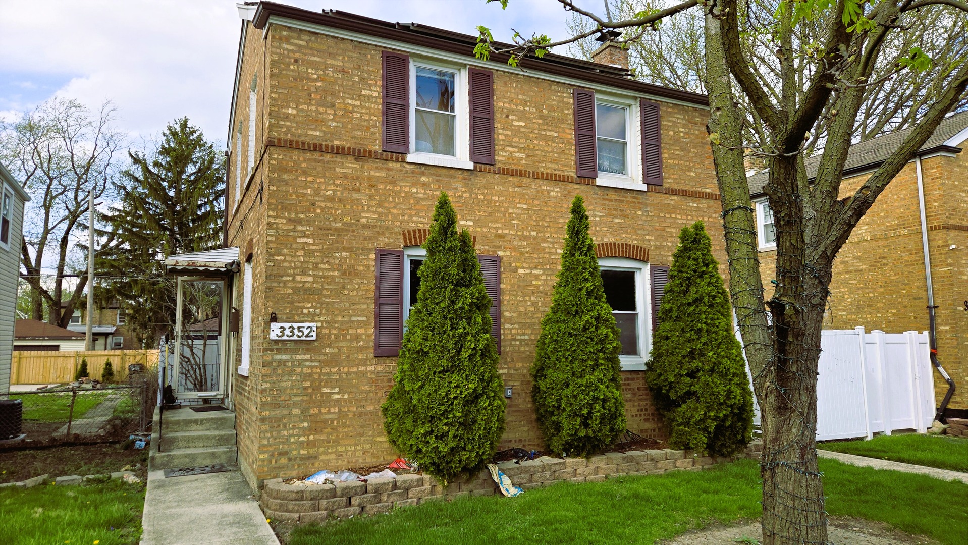 3352 West 84th Street Chicago, IL 60652 - Photo 1 of 26 a view of a brick house with a yard