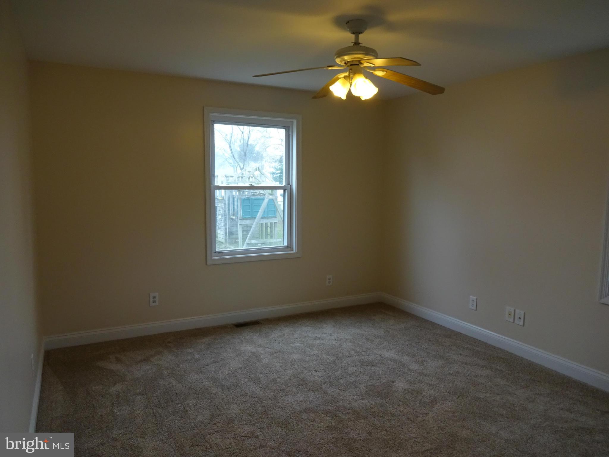 958 Martin Road Baltimore, MD 21221 - Photo 14 of 19 Master Bedroom w/ New Carpeting & Ceiling Fan