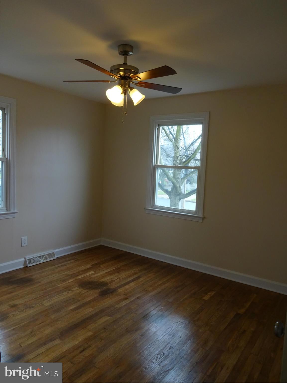 958 Martin Road Baltimore, MD 21221 - Photo 17 of 19 Bedroom 3 w/ Refinished Wood Floors & Ceiling Fan