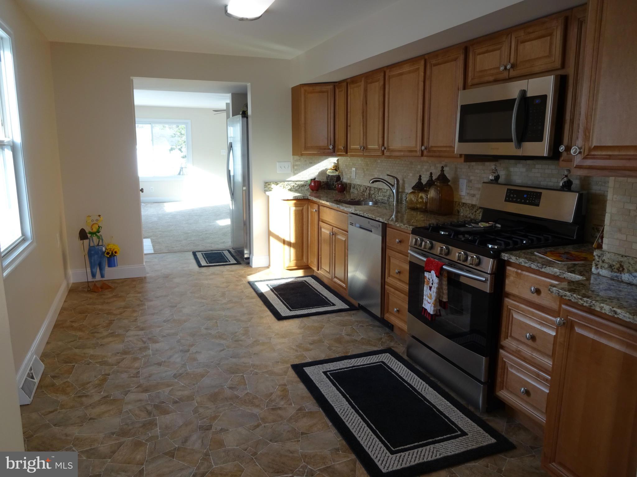 958 Martin Road Baltimore, MD 21221 - Photo 4 of 19 Kitchen w/ Granite Counters, New Stainless