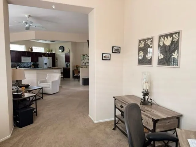 a view of a workspace with furniture