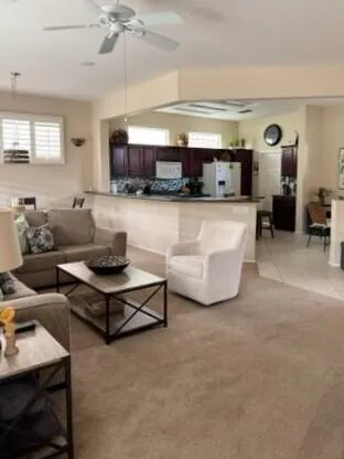 a living room with furniture and a table