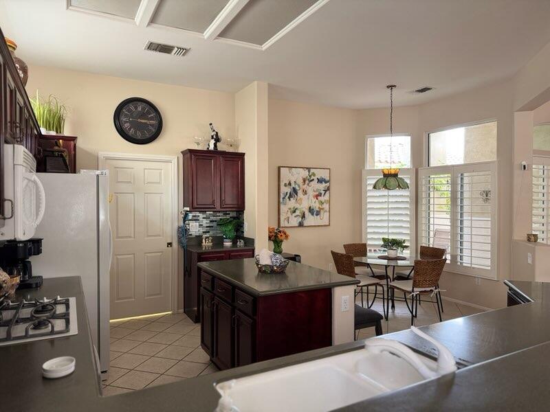 35875 Donny Circle Palm Desert, CA 92211 - Photo 15 of 50 a living room with furniture and wooden floor