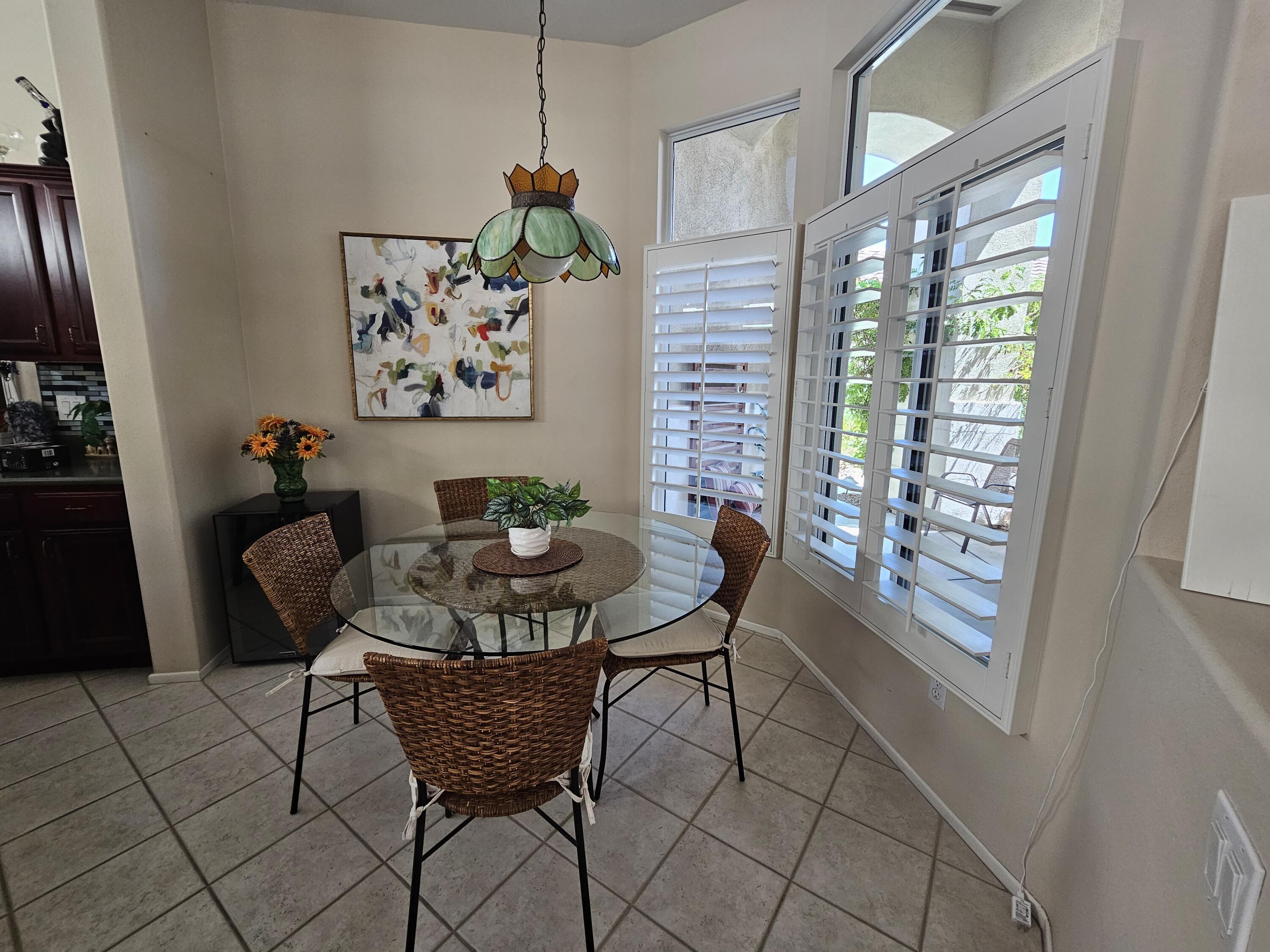 35875 Donny Circle Palm Desert, CA 92211 - Photo 16 of 50 a dining room with furniture and window