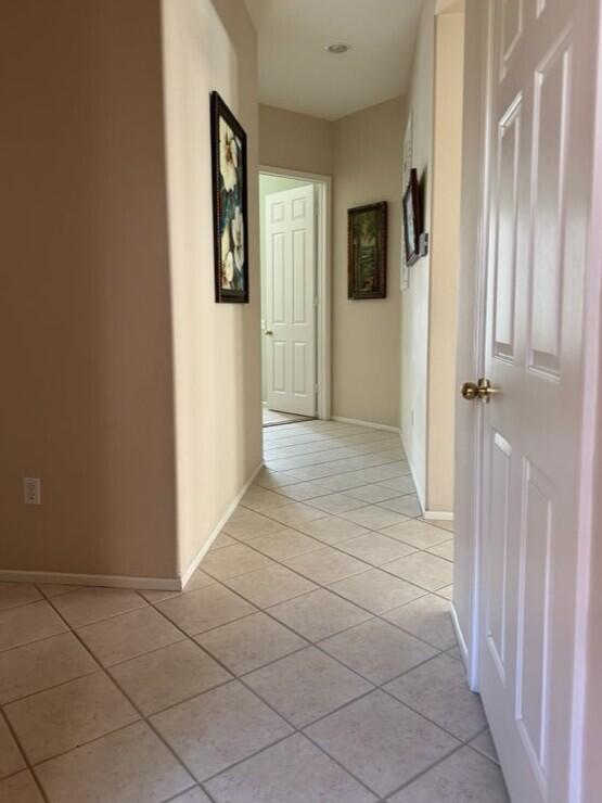 35875 Donny Circle Palm Desert, CA 92211 - Photo 17 of 50 a view of a hallway with wooden floor and a bathroom