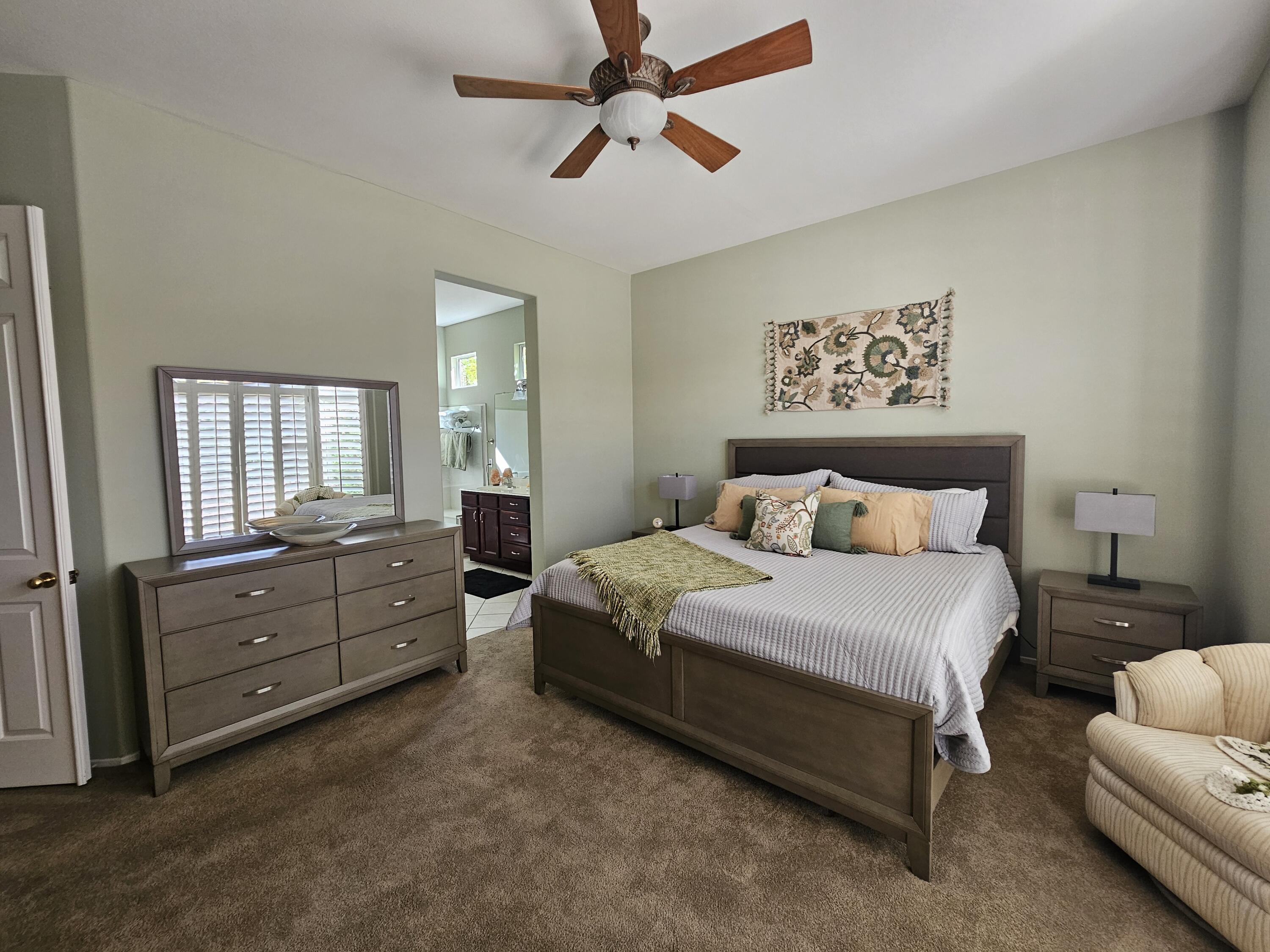 35875 Donny Circle Palm Desert, CA 92211 - Photo 19 of 50 a bedroom with a bed and window