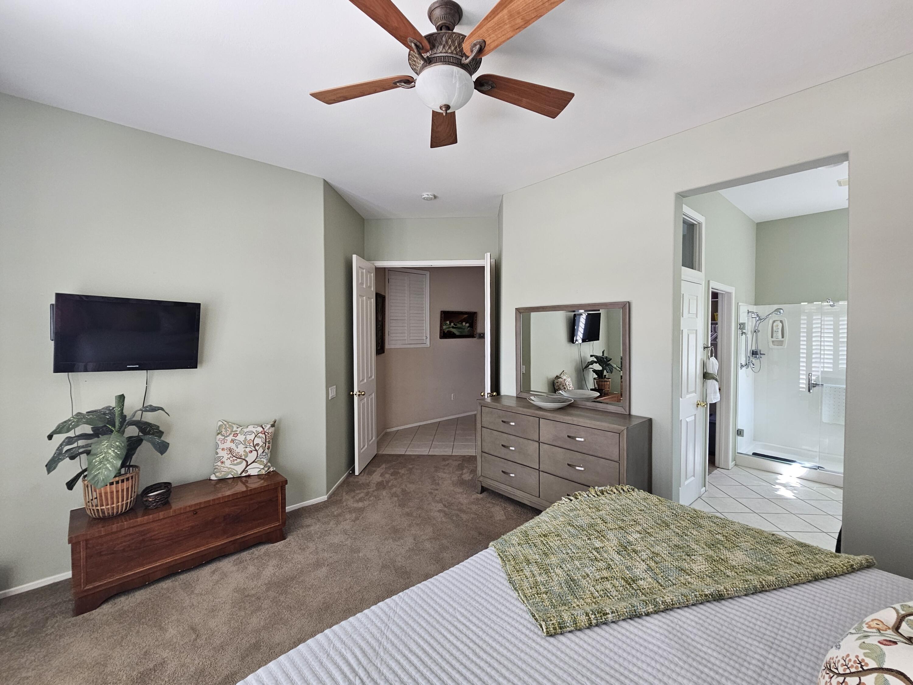 35875 Donny Circle Palm Desert, CA 92211 - Photo 24 of 50 a living room with furniture and a flat screen tv