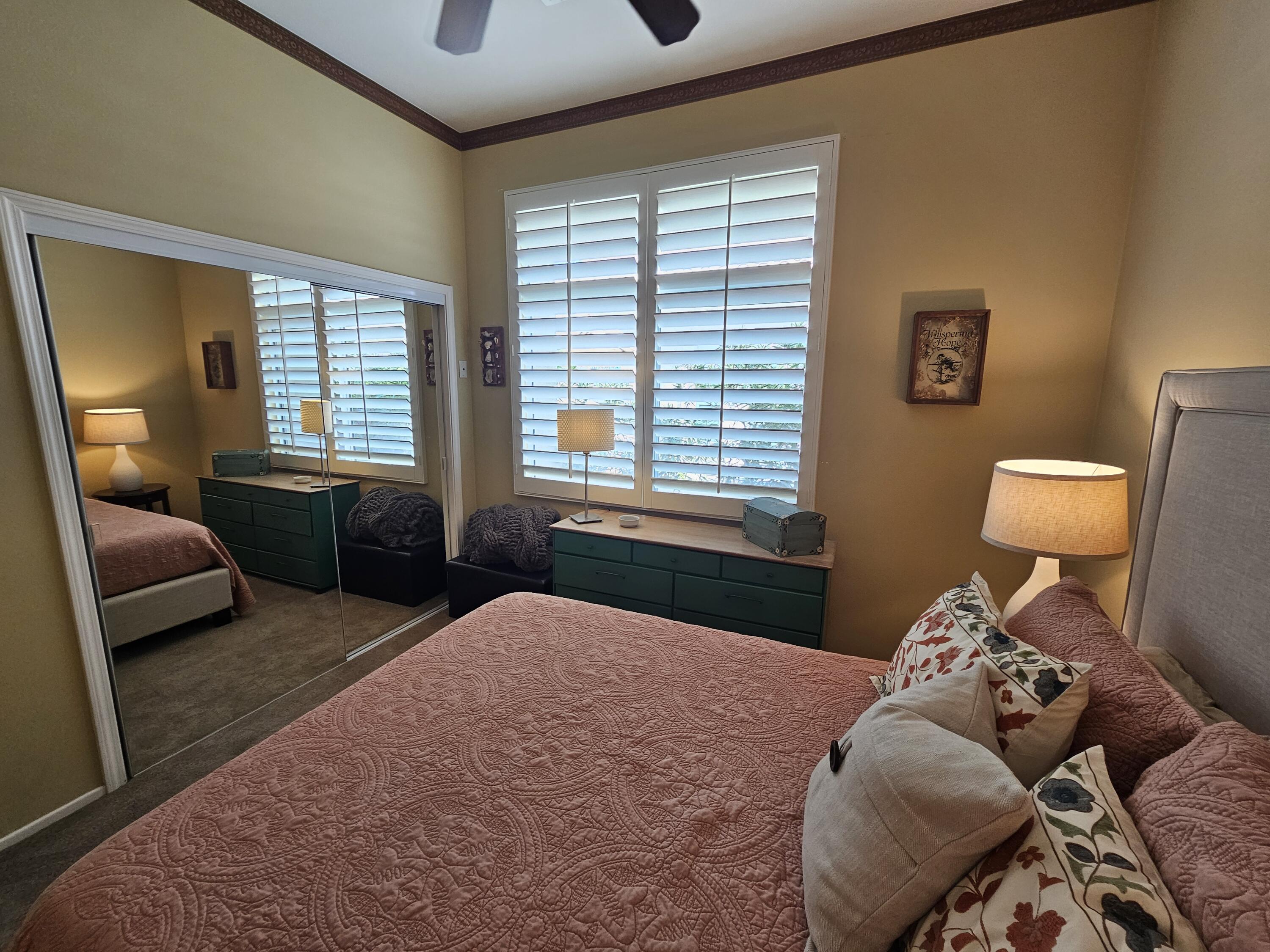 35875 Donny Circle Palm Desert, CA 92211 - Photo 28 of 50 a bedroom with a large bed and a window