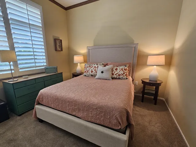 a bedroom with a bed and a closet