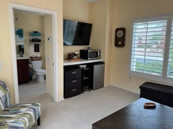 a kitchen with a refrigerator and a stove top oven