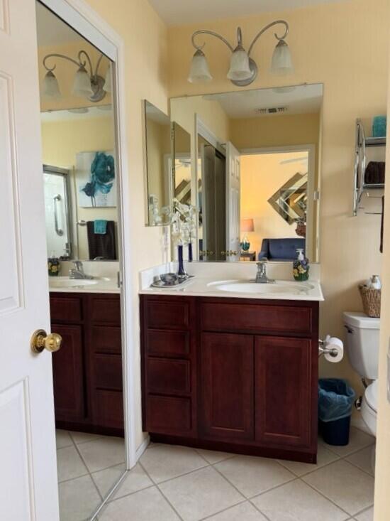 35875 Donny Circle Palm Desert, CA 92211 - Photo 42 of 50 a bathroom with a sink vanity and mirror