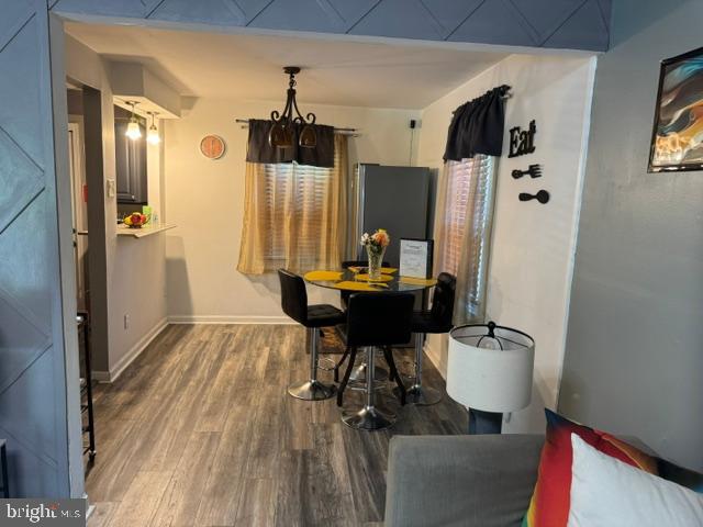 4603 Raleigh Road Temple Hills, MD 20748 - Photo 39 of 40 a view of a dining room with furniture and wooden floor