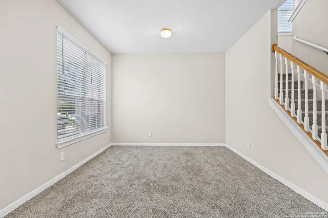 a view of a hallway with staircase