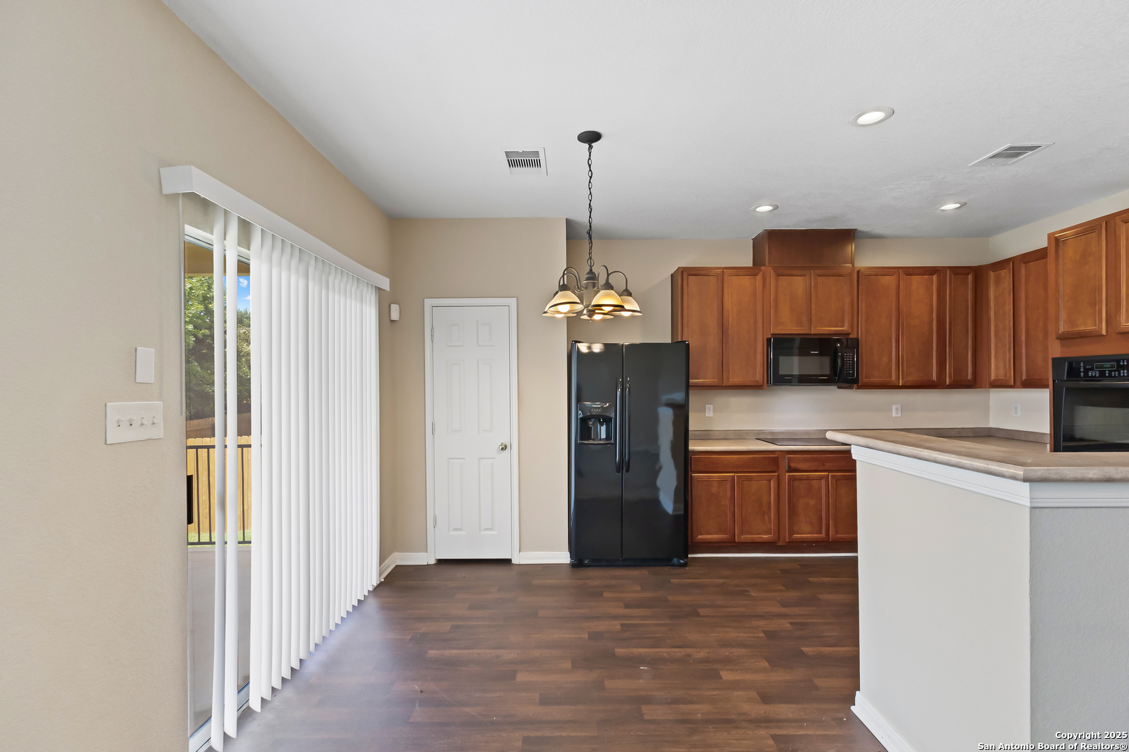 156 Springtree Bluff Cibolo, TX 78108 - Photo 17 of 42 a kitchen with stainless steel appliances granite countertop a refrigerator and a sink