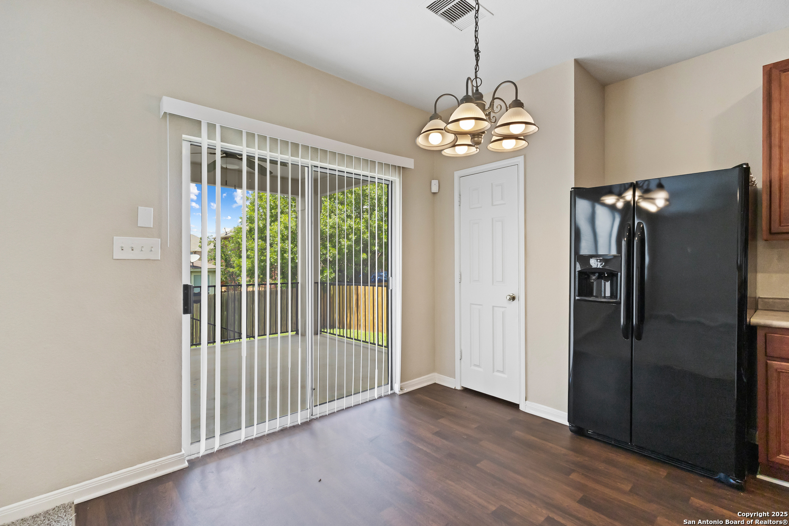 156 Springtree Bluff Cibolo, TX 78108 - Photo 18 of 42 a view of a hallway with wooden floor and chandelier