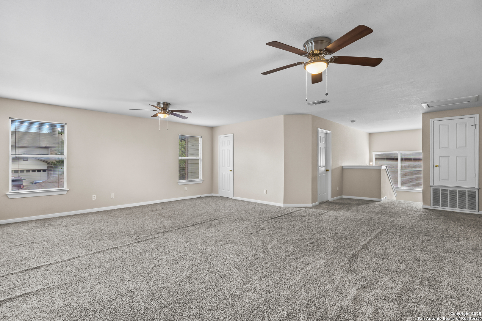 156 Springtree Bluff Cibolo, TX 78108 - Photo 31 of 42 a view of a livingroom with a ceiling fan and window