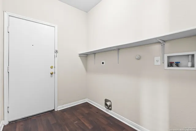 a view of a hallway with a ceiling fan