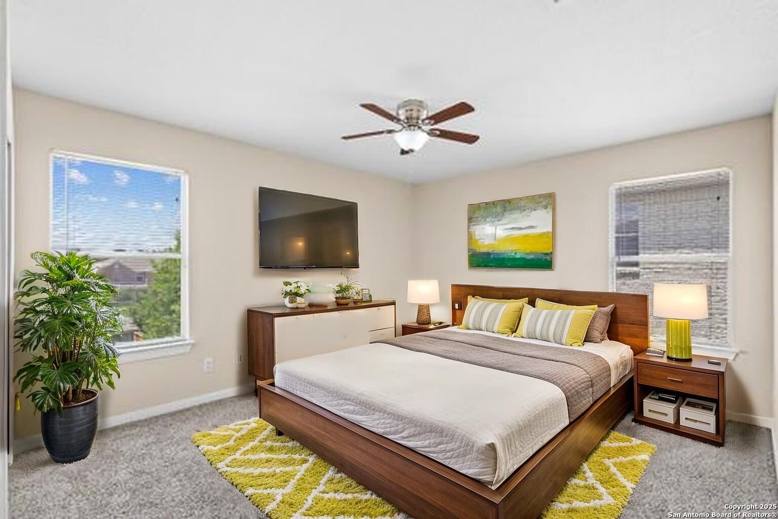 156 Springtree Bluff Cibolo, TX 78108 - Photo 10 of 42 a bedroom with a bed and a flat screen tv