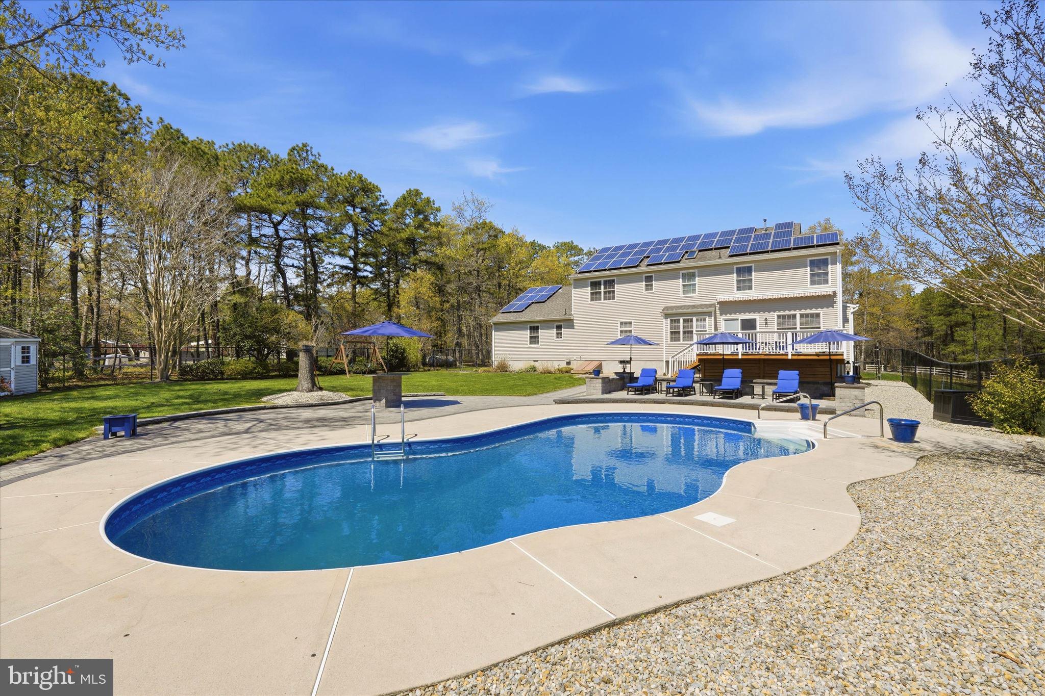 176 Warren Grove Road Barnegat, NJ 08005 - Photo 52 of 71 a view of a swimming pool with a patio