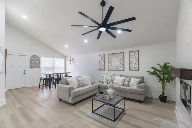 a kitchen with kitchen island granite countertop a sink stainless steel appliances and counter top space