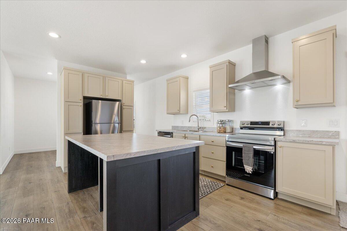 65 Hawaii Road Paulden, AZ 86334 - Photo 5 of 29 a kitchen with a stove and a sink