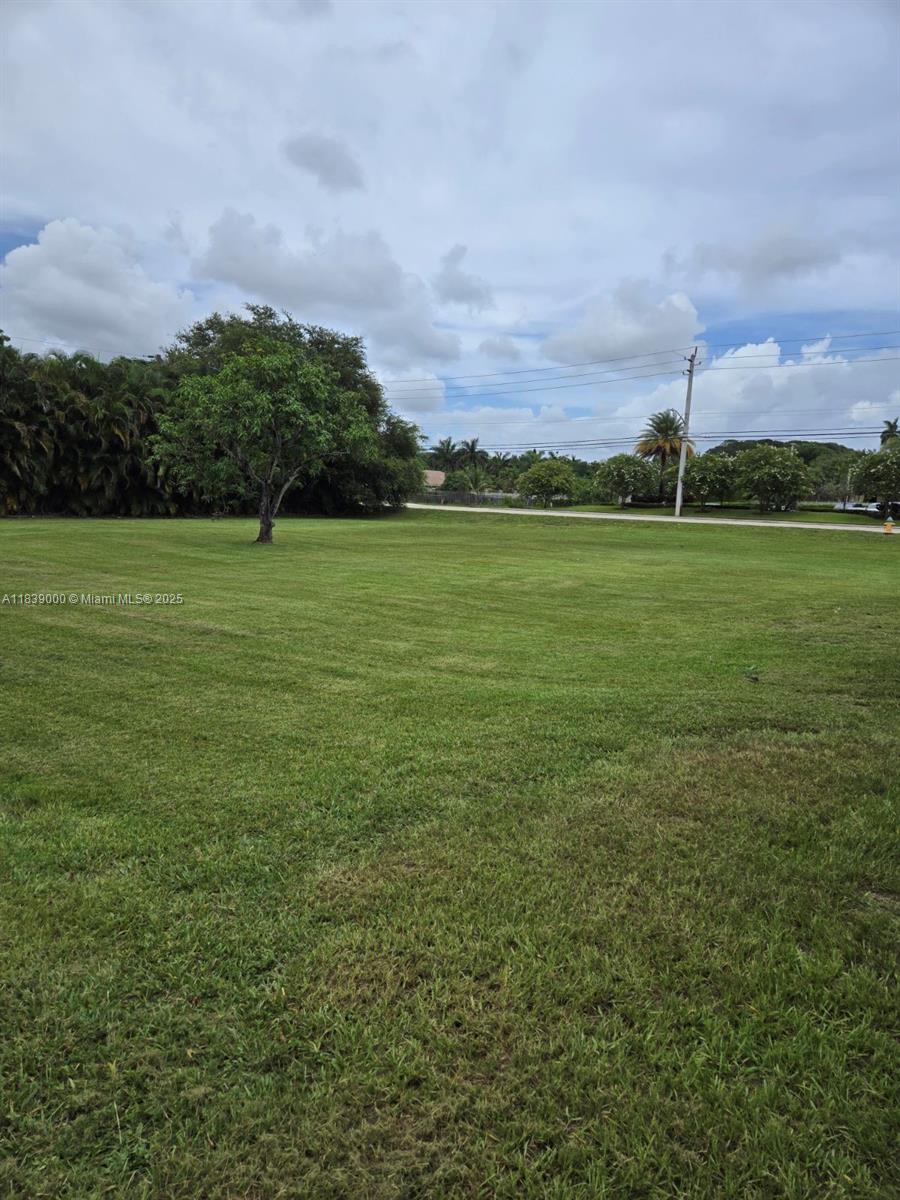 6411 Southwest 56th Street Davie, FL 33314 - Photo 2 of 3 a view of a field with an buildings in the background