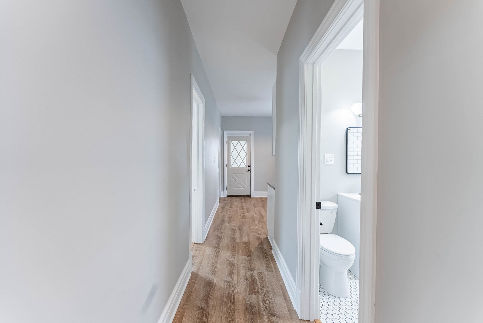 4730 West Warwick Avenue, Unit 2 Chicago, IL 60641 - Photo 11 of 26 a view of a bathroom with a sink and mirror