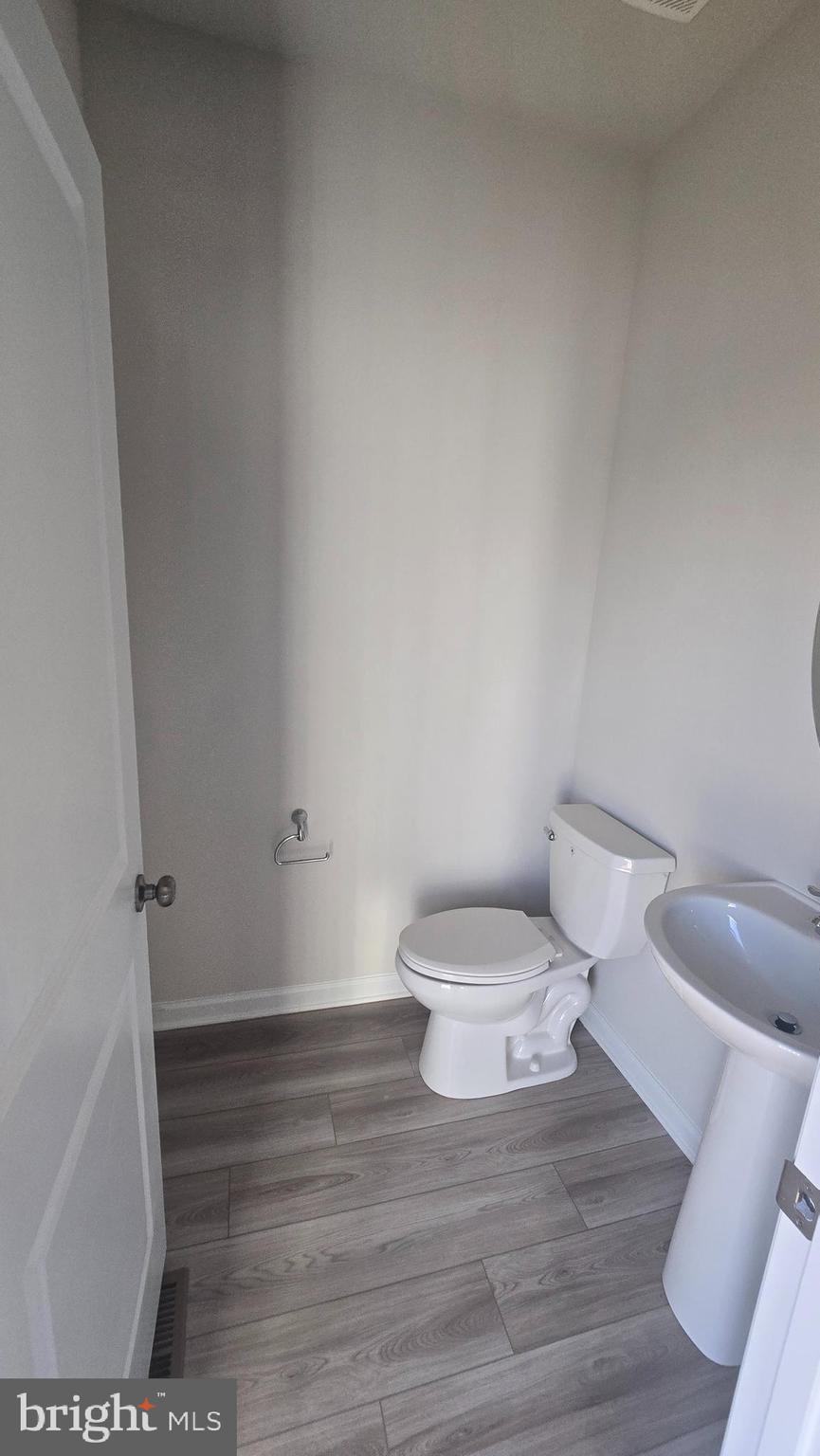 36 Canning Road Inwood, WV 25428 - Photo 22 of 29 a white toilet sitting next to a bathroom sink