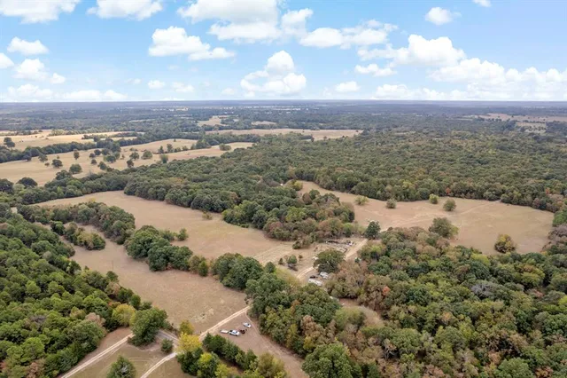 an aerial view of residential building and lake
