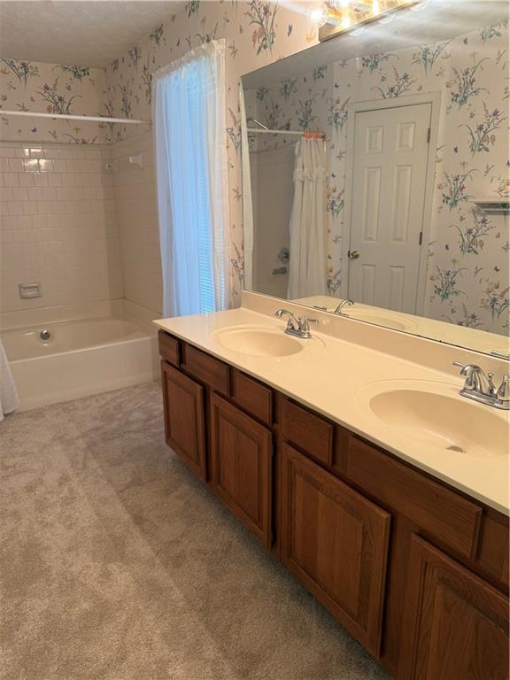 682 Bridge Way Lithonia, GA 30058 - Photo 14 of 25 a spacious bathroom with a granite countertop sink and a mirror