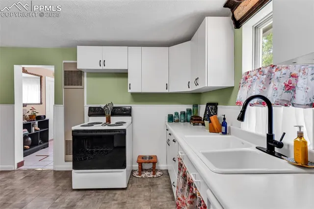 a utility room with sink dryer and washer