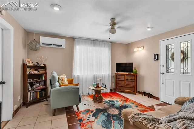 a bedroom with furniture and a flat screen tv