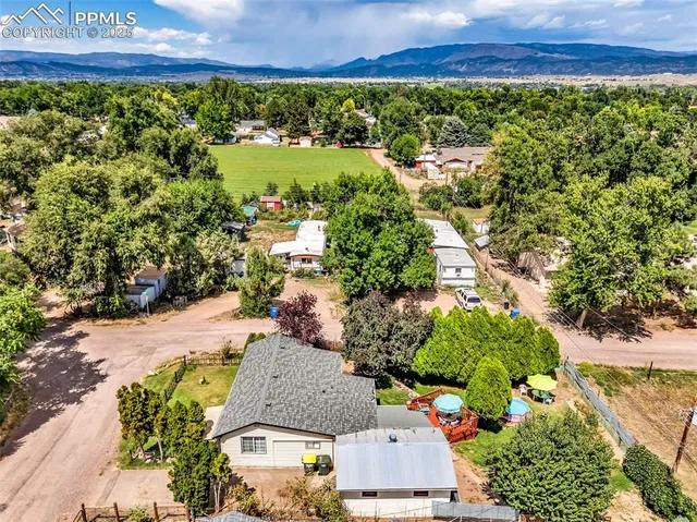 an aerial view of residential houses and outdoor space