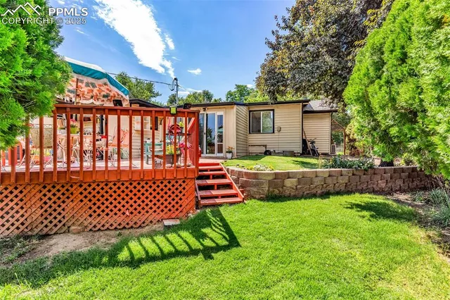 a front view of a house with a yard swing table and chairs