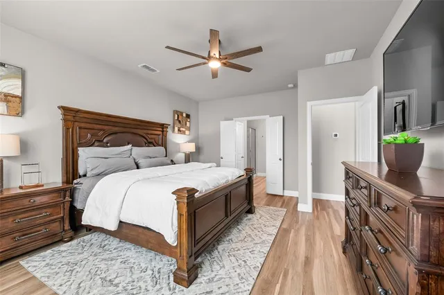 a bedroom with a bed and a table