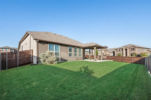 a view of a house with a yard and porch