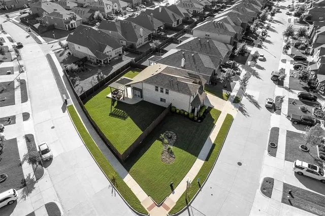 an aerial view of a residential houses with terrace