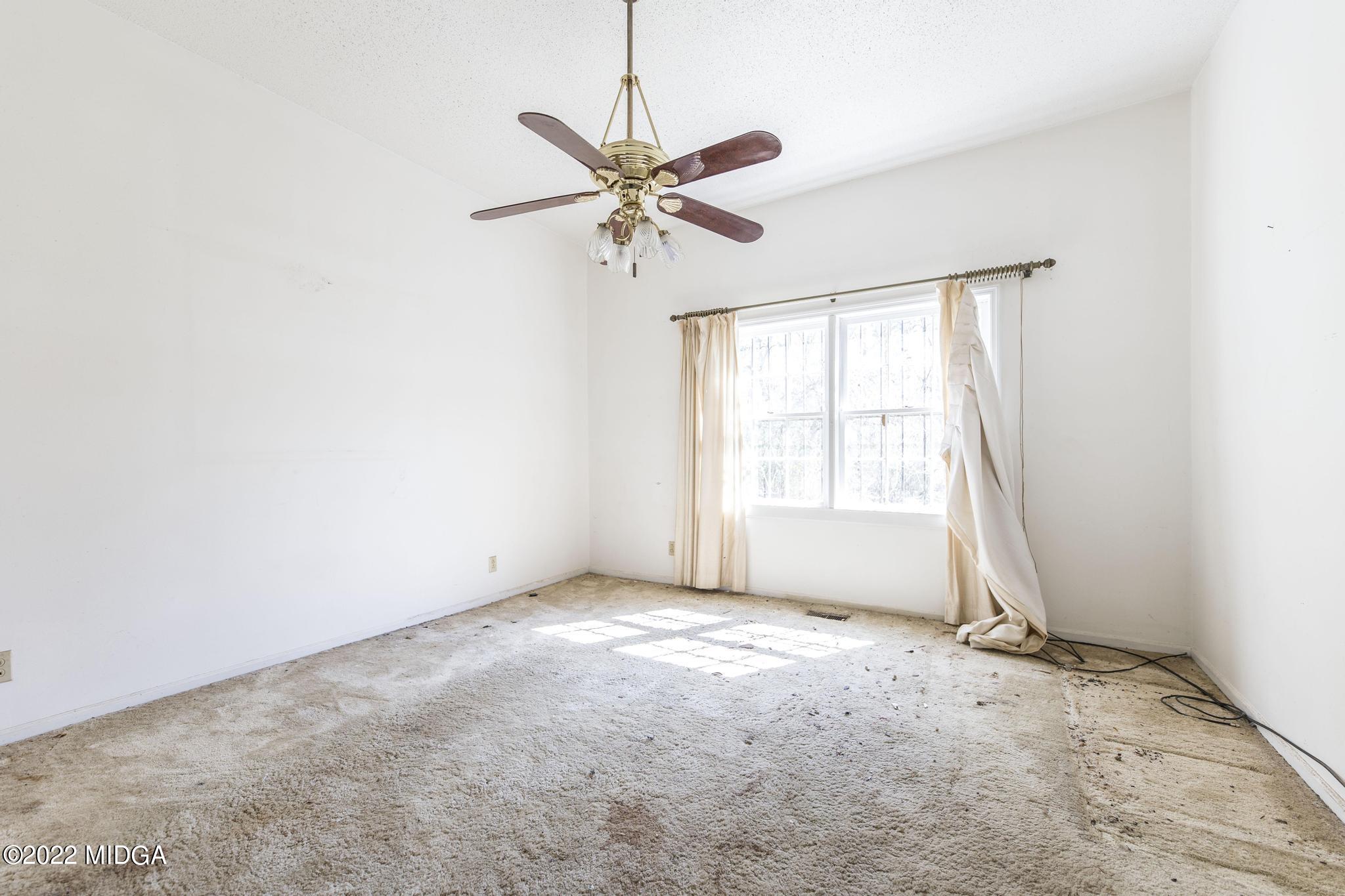 10 Mattie Road Fort Valley, GA 31030 - Photo 19 of 48 a view of a livingroom with a window and a ceiling fan