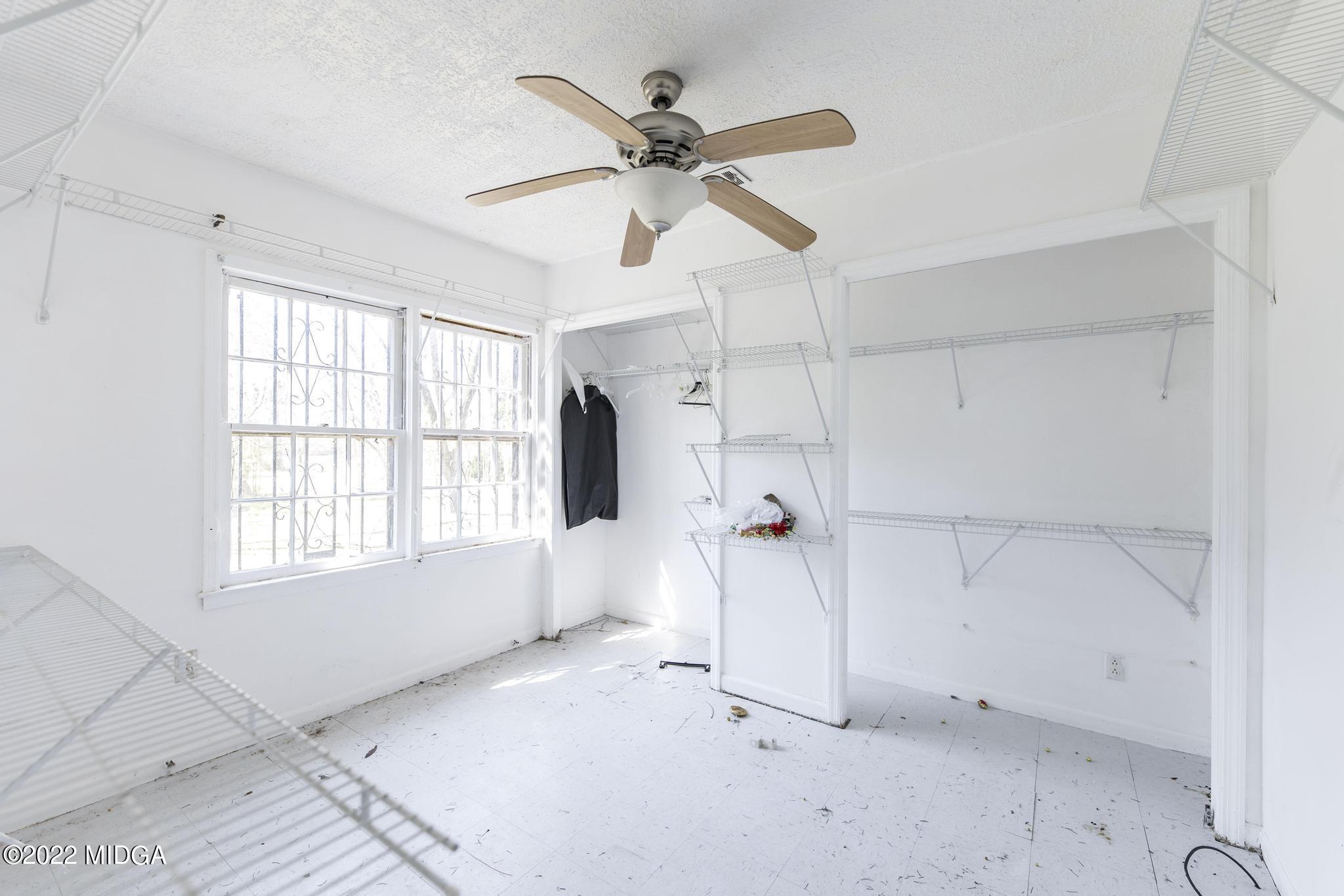 10 Mattie Road Fort Valley, GA 31030 - Photo 28 of 48 a view of empty room with a ceiling fan and window