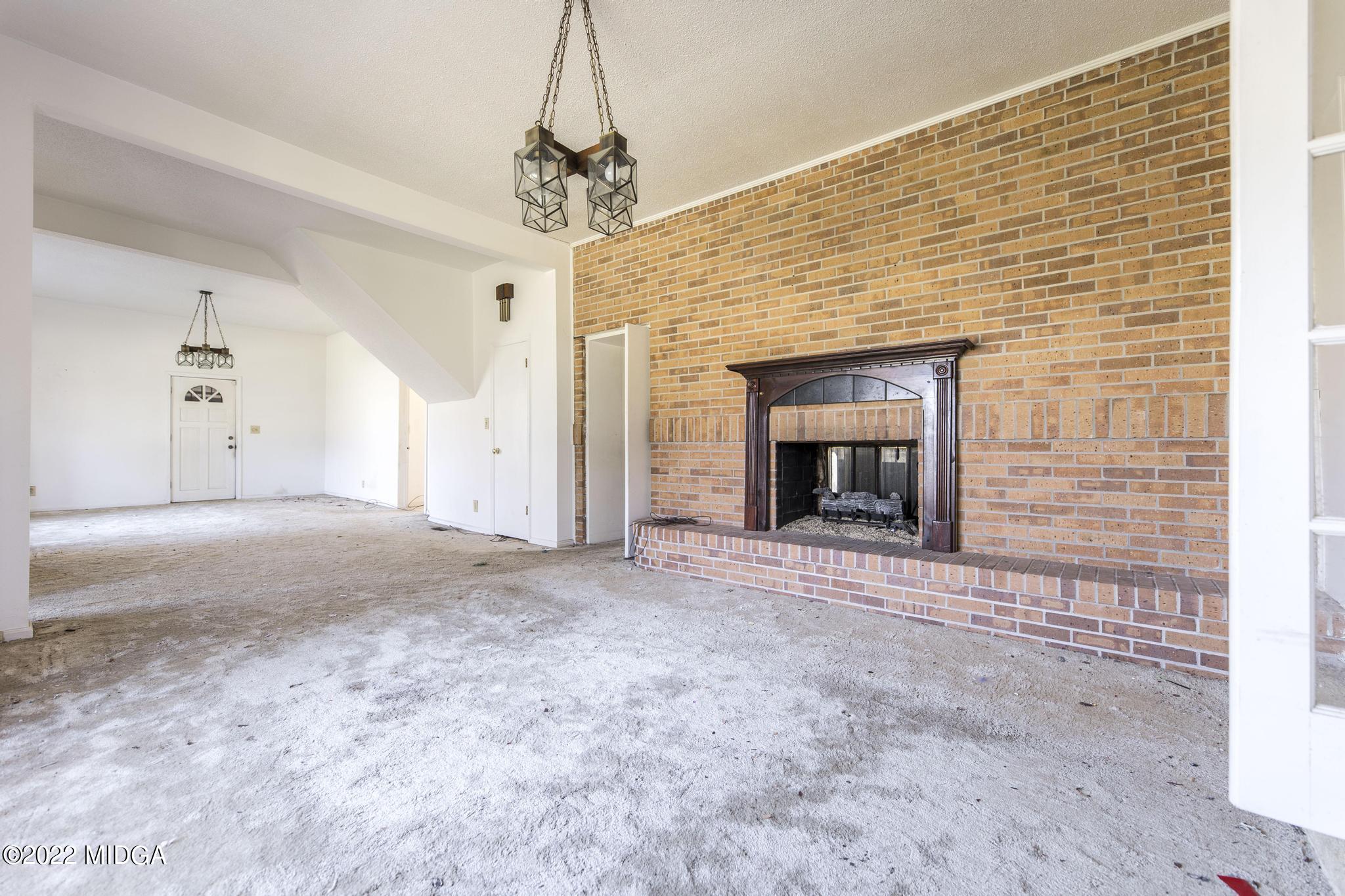 10 Mattie Road Fort Valley, GA 31030 - Photo 8 of 48 a view of empty room with fireplace and window