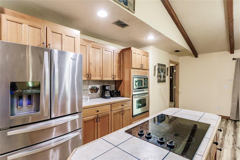 5826 Highway 72 Arcadia, FL 34266 - Photo 24 of 62 a kitchen with stainless steel appliances a refrigerator sink and stove