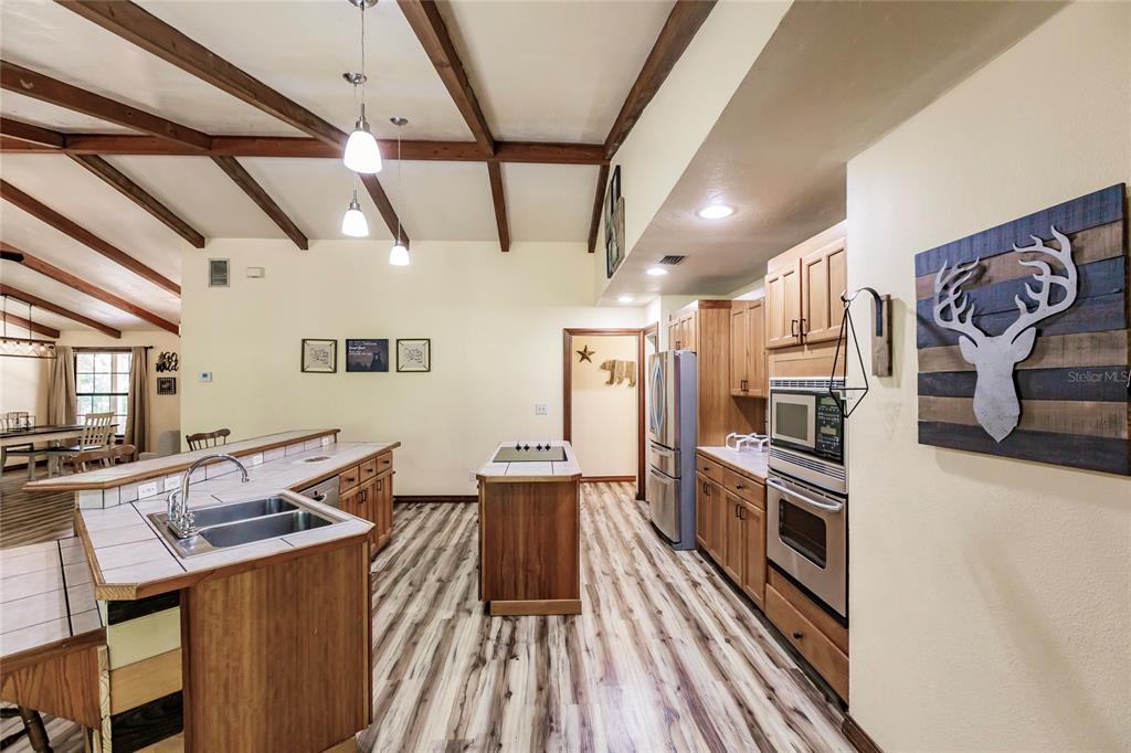 5826 Highway 72 Arcadia, FL 34266 - Photo 25 of 62 a kitchen with stainless steel appliances granite countertop lots of counter top space