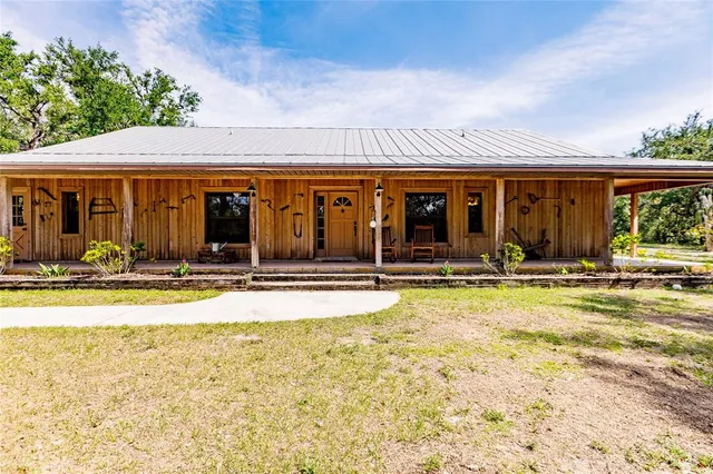 a view of swimming pool with outdoor seating