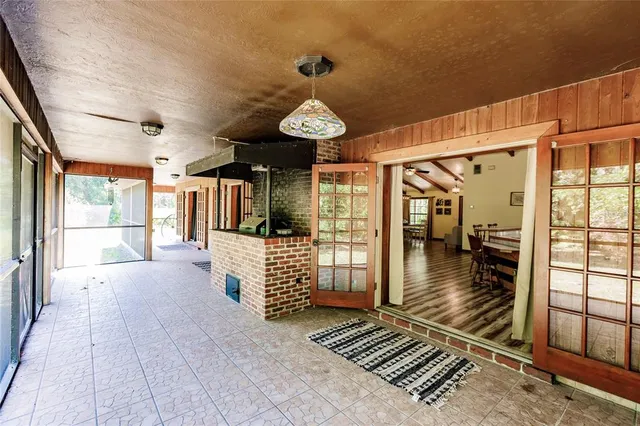 a view of a room with lots of windows