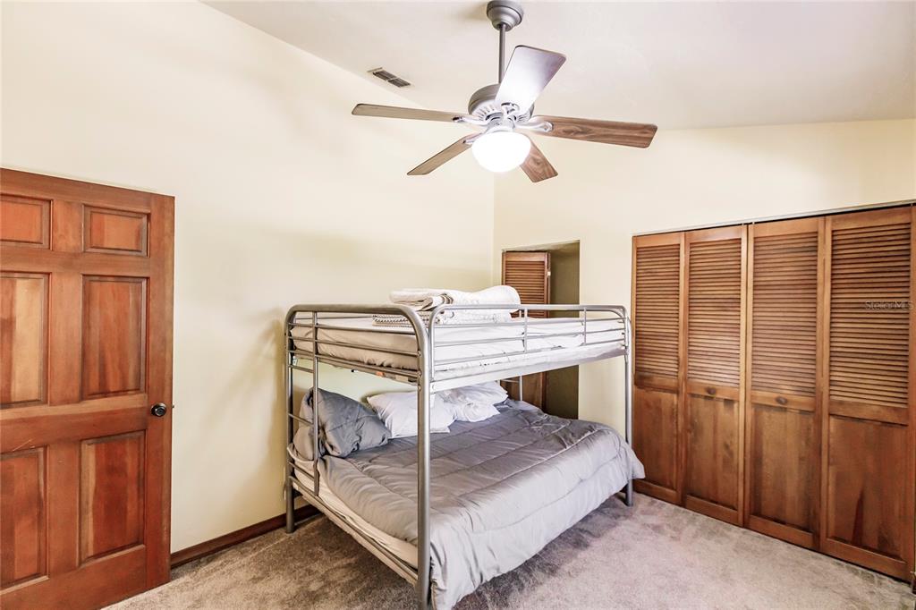 5826 Highway 72 Arcadia, FL 34266 - Photo 35 of 62 a bedroom with a bunk bed and a window