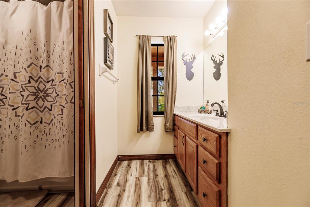 5826 Highway 72 Arcadia, FL 34266 - Photo 36 of 62 a bathroom with a sink and a mirror