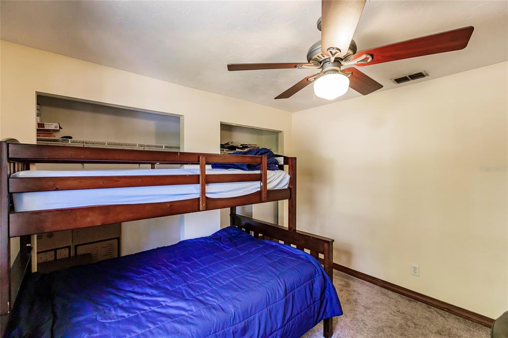 5826 Highway 72 Arcadia, FL 34266 - Photo 39 of 62 a bedroom with a bed and a chandelier