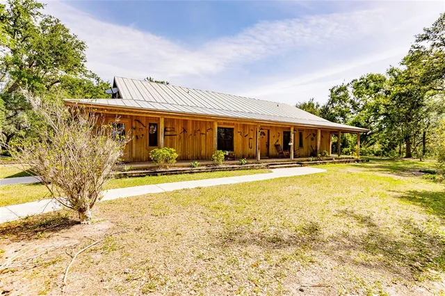 a view of swimming pool with outdoor seating and deck