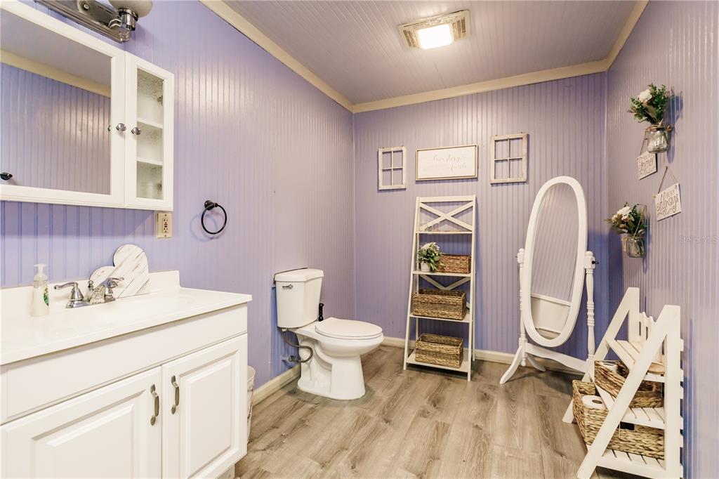 5826 Highway 72 Arcadia, FL 34266 - Photo 57 of 62 a bathroom with a toilet sink and mirror